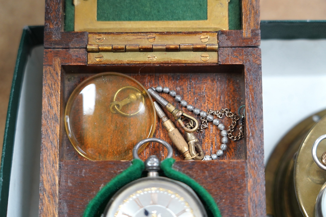 A George V silver Hebdomas eight day patent pocket watch, a late Victorian silver open face pocket watch and two watch cases. Condition - poor to fair